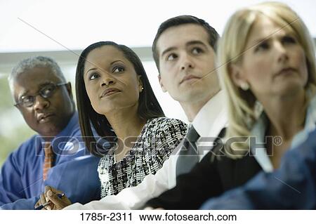 Stock Image - Business colleagues in a meeting. Fotosearch