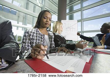 Stock Photo - Business colleagues in a meeting. Fotosearch