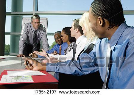Business colleagues in a meeting View Large Photo Image Stock Photo - Business colleagues in a meeting. Fotosearch