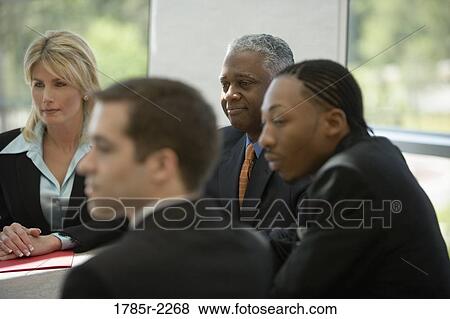 Business colleagues in a meeting View Large Photo Image Stock Photo - Business colleagues in a meeting. Fotosearch