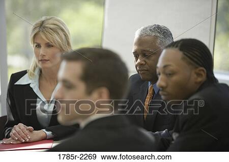 Stock Photo - Business colleagues in a meeting. Fotosearch