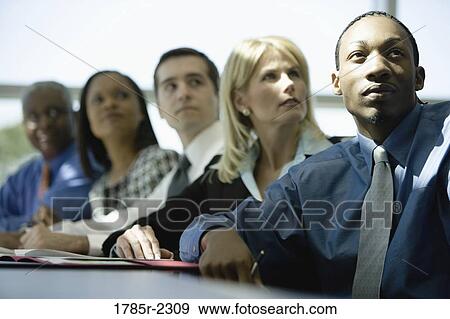 Stock Photo - Business colleagues in a meeting. Fotosearch