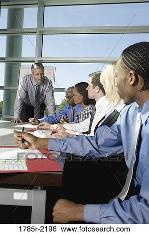 Stock Photograph - Business colleagues in a meeting. Fotosearch