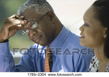 Picture - Business colleagues working in an office. Fotosearch