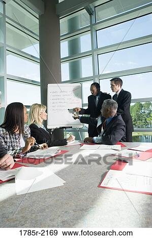 Business presentation in conference room View Large Photo Image Stock Photo - Business presentation in conference room. Fotosearch