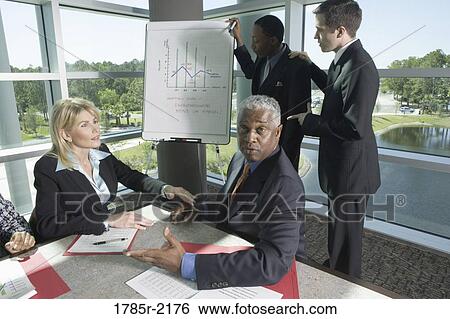 Business presentation in conference room View Large Photo Image Stock Photograph - Business presentation in conference room. Fotosearch