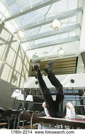 Businessman lifting up legs View Large Photo Image Picture - Businessman lifting up legs. Fotosearch