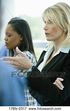Businesswomen standing together View Large Photo Image Stock Photo - Businesswomen standing together. Fotosearch