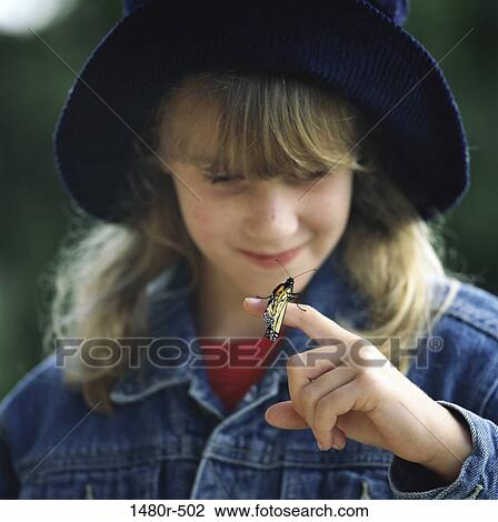 Butterfly sitting on a girl's finger View Large Photo Image Stock Image - Butterfly sitting on a girl's finger. Fotosearch