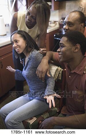 Cheerful African American family in kitchen View Large Photo Image Stock Image - Cheerful African American family in kitchen. Fotosearch