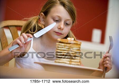 Child ready to eat huge stack of pancakes View Large Photo Image Stock Image - Child ready to eat huge stack of pancakes. Fotosearch
