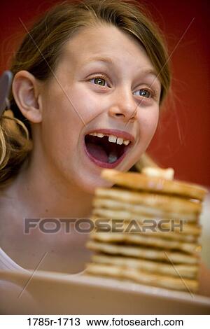 Child ready to eat huge stack of pancakes View Large Photo Image Stock Image - Child ready to eat huge stack of pancakes. Fotosearch