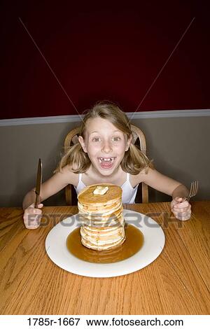 Child ready to eat huge stack of pancakes View Large Photo Image Stock Photo - Child ready to eat huge stack of pancakes. Fotosearch