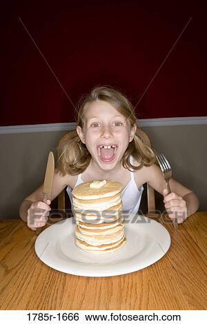 Child ready to eat huge stack of pancakes View Large Photo Image Stock Photograph - Child ready to eat huge stack of pancakes. Fotosearch