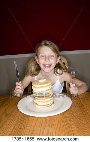Child ready to eat huge stack of pancakes View Large Photo Image Stock Photography - Child ready to eat huge stack of pancakes. Fotosearch