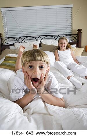 Children playing in bedroom View Large Photo Image Stock Image - Children playing in bedroom. Fotosearch