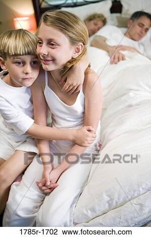 Children waiting for parents to wake up View Large Photo Image Stock Image - Children waiting for parents to wake up. Fotosearch