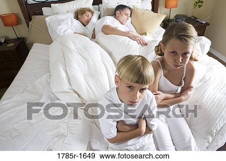 Children waiting for parents to wake up View Large Photo Image Stock Photo - Children waiting for parents to wake up. Fotosearch
