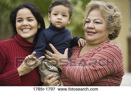 Close-up of a 3-generation family View Large Photo Image Stock Photo - Close-up of a 3-generation family. Fotosearch