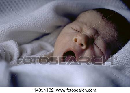 Close-up of a baby boy yawning View Large Photo Image Stock Image - Close-up of a baby boy yawning. Fotosearch