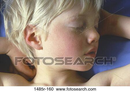 Close-up of a boy sleeping View Large Photo Image Stock Image - Close-up of a boy sleeping. Fotosearch