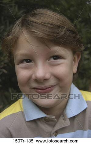 Close-up of a boy smiling View Large Photo Image Stock Photography - Close-up of a boy smiling. Fotosearch