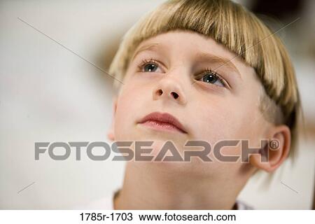 Close-up of a boy staring up into space View Large Photo Image Stock Image - Close-up of a boy staring up into space. Fotosearch
