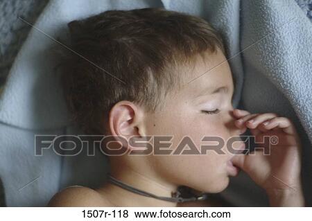 Close-up of a boy sucking his thumb View Large Photo Image Stock Photo - Close-up of a boy sucking his thumb. Fotosearch