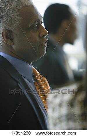 Stock Image - Close-up of a contemplative businessman. Fotosearch