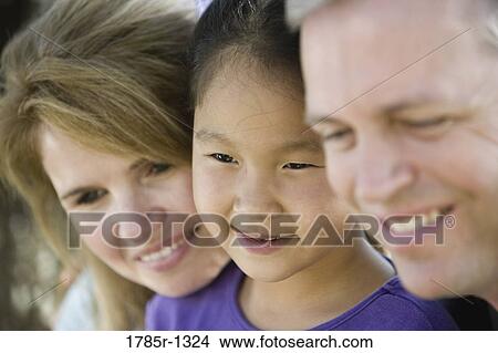 Close-up of a family View Large Photo Image Picture - Close-up of a family. Fotosearch
