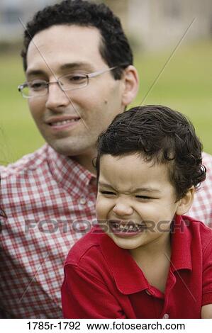 Close-up of a father and a son View Large Photo Image Stock Image - Close-up of a father and a son. Fotosearch