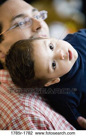Close-up of a father and little boy View Large Photo Image Stock Image - Close-up of a father and little boy. Fotosearch