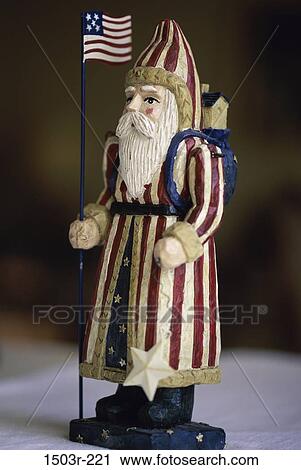 Close-up of a Santa Claus doll dressed in the American flag View Large Photo Image Stock Image - Close-up of a Santa Claus doll dressed in the American flag. Fotosearch