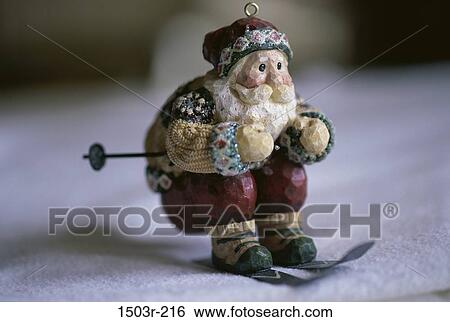 Stock Photograph - Close-up of a Santa Claus doll skiing. Fotosearch