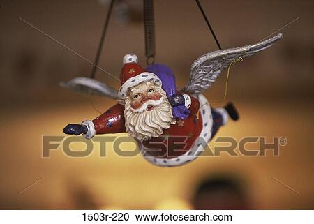 Close-up of a Santa Claus doll with wings View Large Photo Image Stock Image - Close-up of a Santa Claus doll with wings. Fotosearch