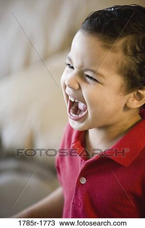 Close-up of a screaming boy View Large Photo Image Stock Image - Close-up of a screaming boy. Fotosearch