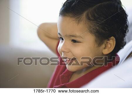 Close-up of a smiling little boy View Large Photo Image Stock Image - Close-up of a smiling little boy. Fotosearch
