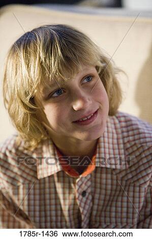 Close-up of a teenage boy smiling View Large Photo Image Stock Photograph - Close-up of a teenage boy smiling. Fotosearch