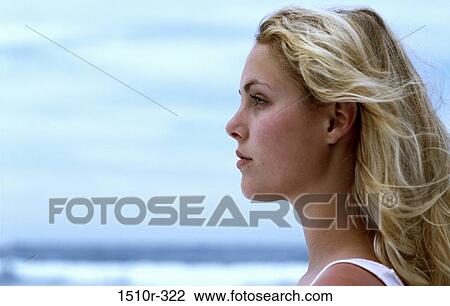 Close-up of a young woman on the beach View Large Photo Image Stock Image - Close-up of a young woman on the beach. Fotosearch