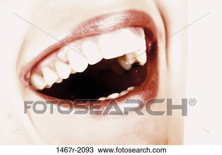 Close-up of a young woman's open mouth View Large Photo Image Stock Image - Close-up of a young woman's open mouth. Fotosearch