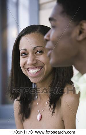 Stock Image - Close-up of African American couple smiling. Fotosearch