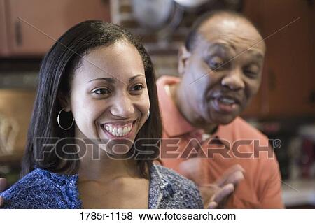 Close-up of African American father and daughter View Large Photo Image Stock Photo - Close-up of African American father and daughter. Fotosearch