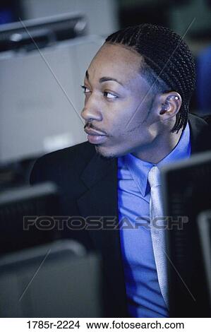 Picture - Close-up of businessman in front of computer monitor. Fotosearch