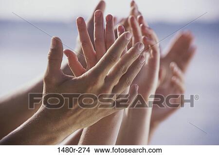 Close-up of people's hands raised View Large Photo Image Picture - Close-up of people's hands raised. Fotosearch