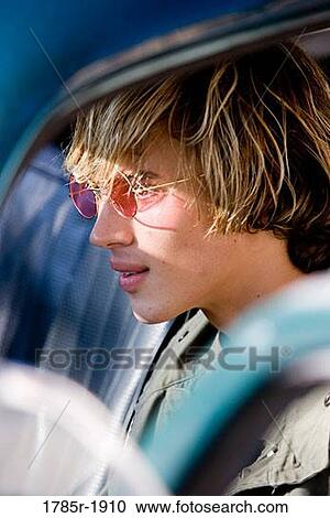 Stock Image - Close-up of teenage driver. Fotosearch