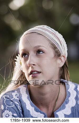 Stock Photo - Close up of young woman wearing headband. Fotosearch