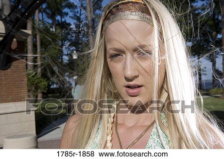 Close up of young woman with long blonde hair View Large Photo Image Stock Photo - Close up of young woman with long blonde hair. Fotosearch
