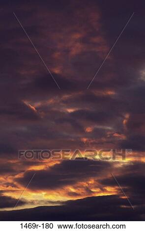 Clouds in the sky during sunset View Large Photo Image Stock Image - Clouds in the sky during sunset. Fotosearch