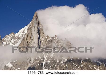 Clouds over mountains, Aiguille Du Dru, French Alps, Chamonix, France View Large Photo Image Stock Image - Clouds over mountains, Aiguille Du Dru, French Alps, Chamonix, France. Fotosearch