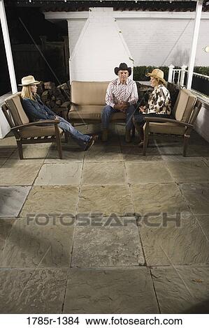 Country family sitting on a sofa View Large Photo Image Picture - Country family sitting on a sofa. Fotosearch